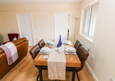 The dining area at Ramsey Lodge, Bier Wood Lodges, Manorbier