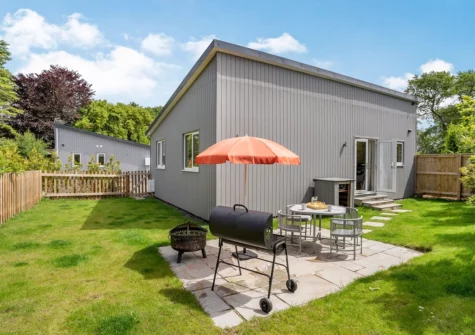 The patio, alfresco dining & barbecue area at Ramsey Lodge, Bier Wood Lodges, Manorbier