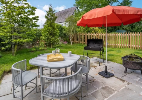 The patio, alfresco dining & barbecue area at Ramsey Lodge, Bier Wood Lodges, Manorbier