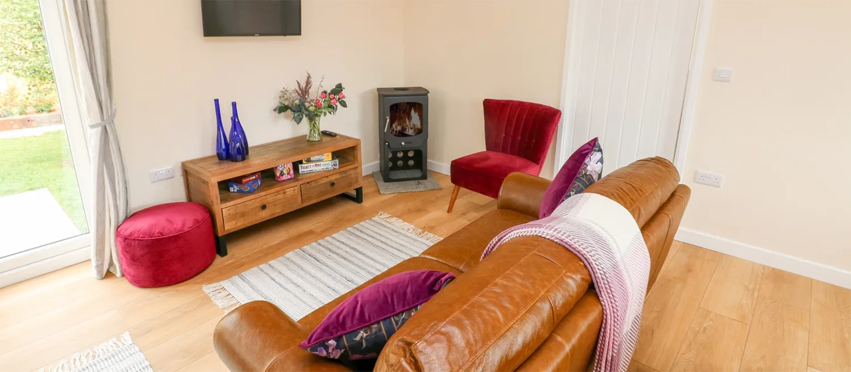Ramsey Lodge, Bier Wood Lodges, Manorbier is a two-bedroom timber lodge with a contemporary interior, set in the beautiful Pembrokeshire countryside. It features an open-plan living space, a well-equipped kitchen & a veranda with outdoor furniture.