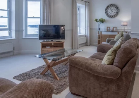 South Beach View, Tenby is a luxurious third-floor apartment with stunning views out to sea, comfortably sleeping four guests. It features a well-equipped kitchen, a spacious lounge two en-suite bedrooms and it's just 50 metres from the beach.