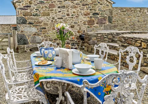 The alfresco dining & barbecue area at St Davids Farmhouse, Porthclais