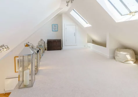 Climb the small wooden staircase up to the mezzanine level, where you will find a daybed for extra seating