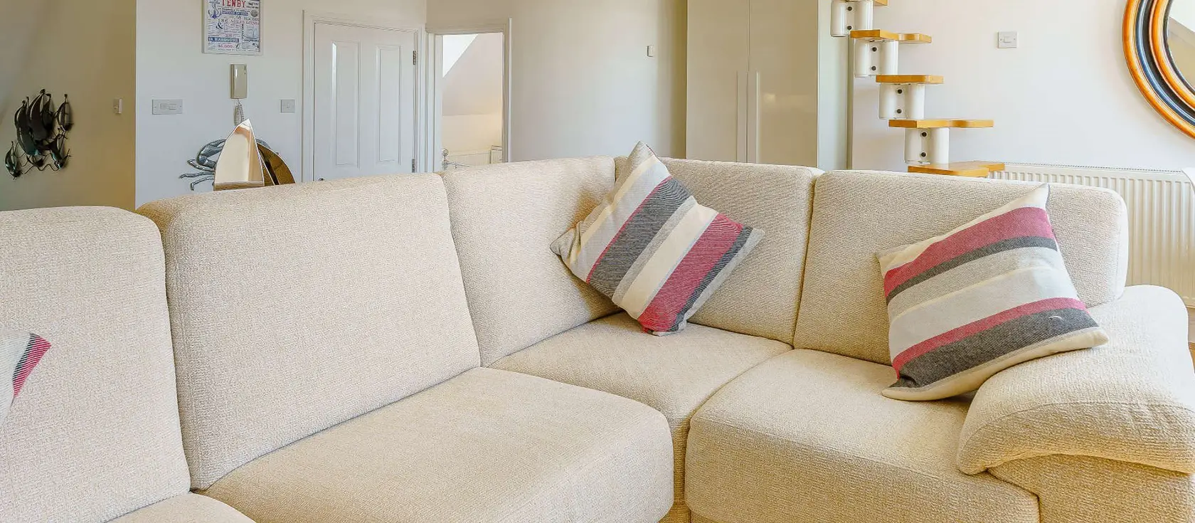 Tall Ships, Tenby is a modern penthouse apartment steps from South Beach, offering light-filled spaces, comfortable bedrooms, and a unique mezzanine retreat. Explore Tenby's harbour, restaurants, & nearby attractions for a memorable coastal break.