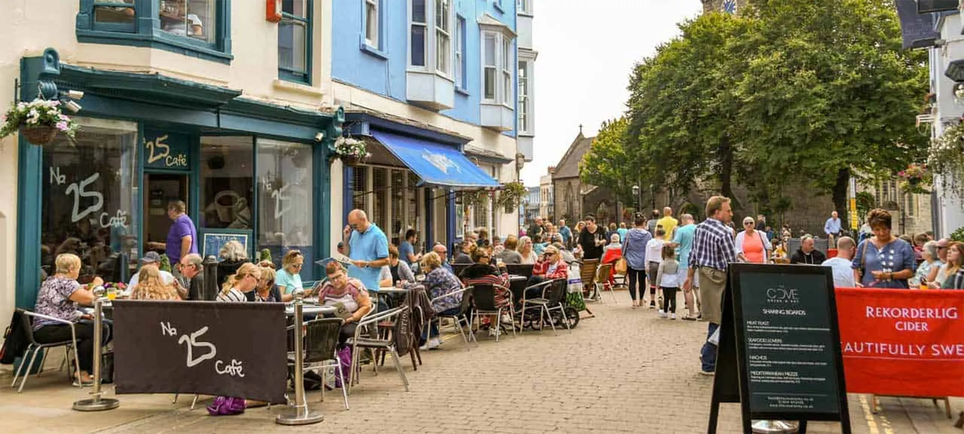 In summer, the centre of Tenby is pedestrianised during the day. The many cafes, pubs and restaurants make the most of this by spilling outdoors, filling the pavements with tables and colourful parasols until you could mistake Tenby for somewhere in the Mediterranean. However, these summer months are also the busiest, especially with families and young children making the most of the school holidays.
