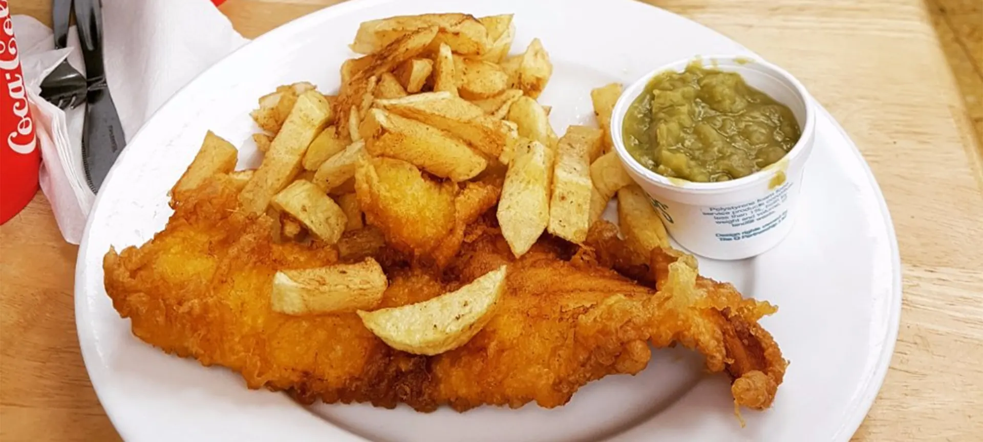 Just like Tenby holds that inexplicable hold over the families who descend every summer, so does the allure of fish and chips straight out of the paper with the salt stinging your fingers and the vinegar scent making your eyes water. It's impossible to imagine a trip to Tenby without fish and chips from Fecci's.