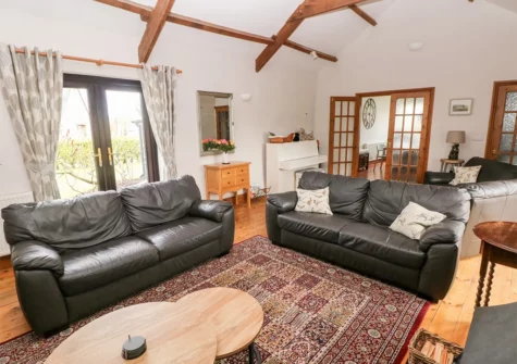 The living room at The Barn at Harrolds Farm, Redberth