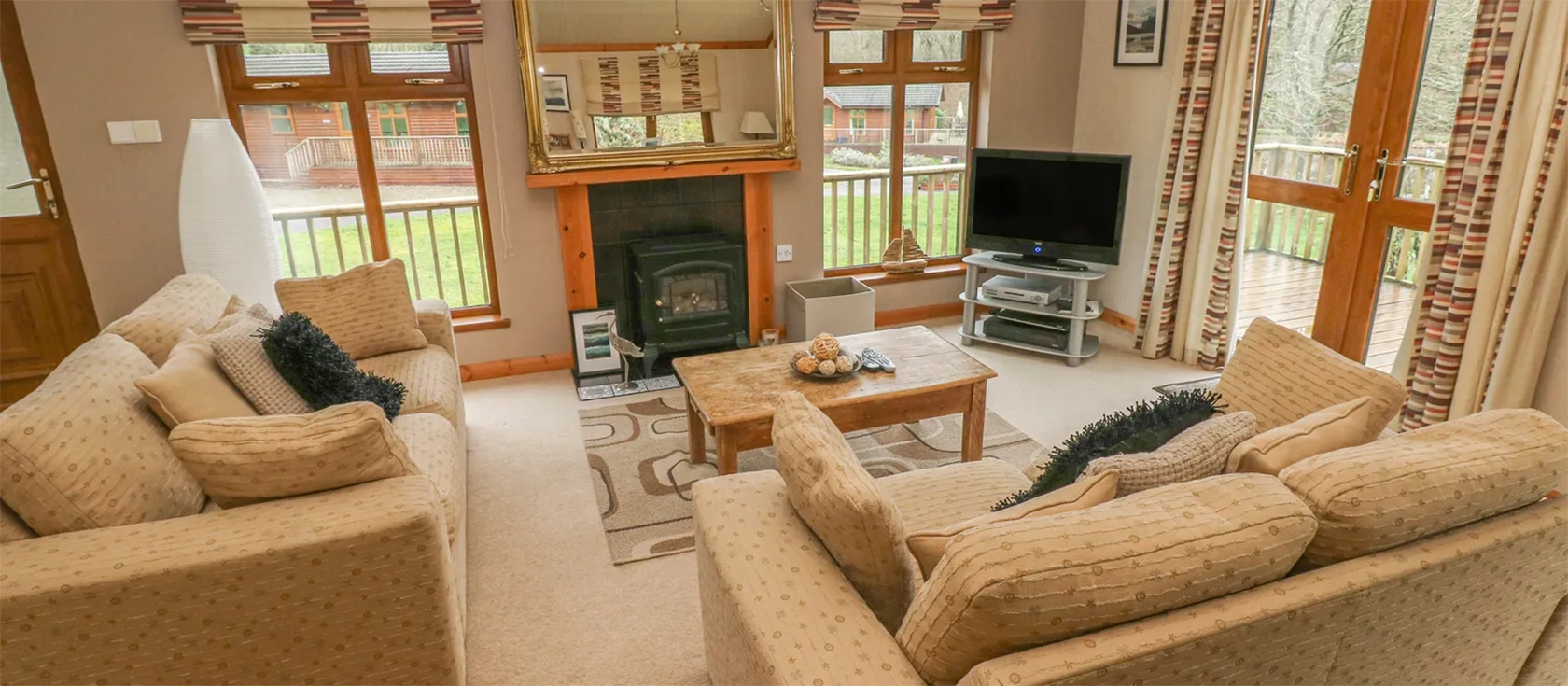 The Beeches, Herons Brook Retreat, Narberth is a luxurious lodge set in 30 acres of ancient woodland, with a tranquil lake view and a private decked patio with spa bath. It's a perfect base for a relaxing break in the Pembrokeshire countryside.