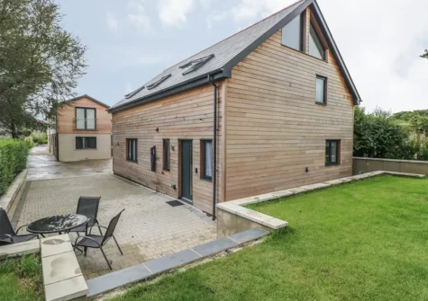 The patio, alfresco dining area & garden at The Boathouse, Tenby
