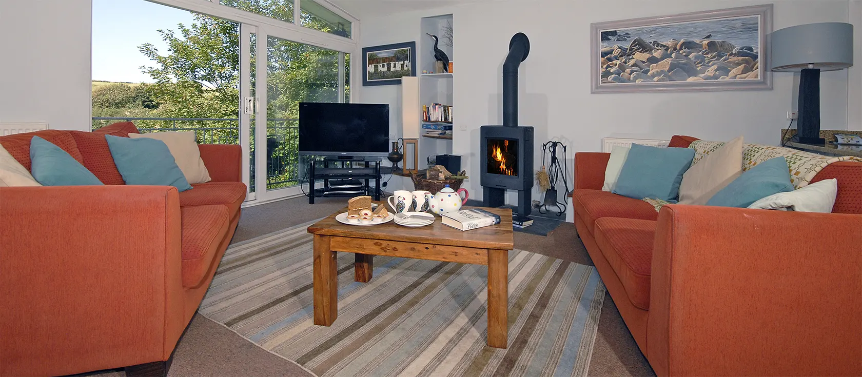 The Burgage, Nolton Haven is an iconic contemporary home with three bedrooms, two bathrooms and split-level living area. Full height windows overlook the two acre gardens & rolling hills. Gourmet kitchen, woodburner stove, parking. Stroll to pub & beach.