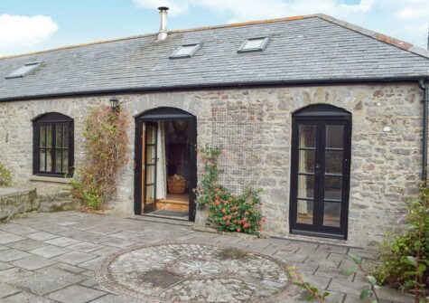 The patio at The Byre, Lyserry Barns, St Twynnells