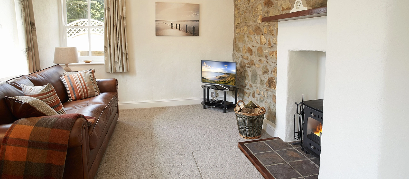 The Dairy, Dinas is a charming one-bedroom cottage in a peaceful location. Enjoy a tranquil rural escape in this pet-friendly cottage with spacious rooms, wood-burning fire, pretty patio and garden, and miles of walking trails from the doorstep.