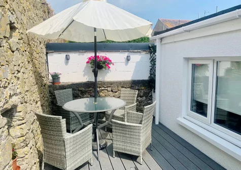 The decked patio & alfresco dining area at The Edge, Tenby