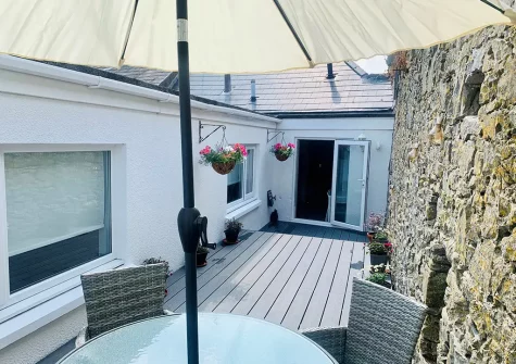 The decked patio & alfresco dining area at The Edge, Tenby