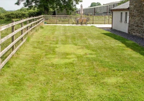 The patio, alfresco dining & barbecue area and garden at The Hagguard, Jeffreyston