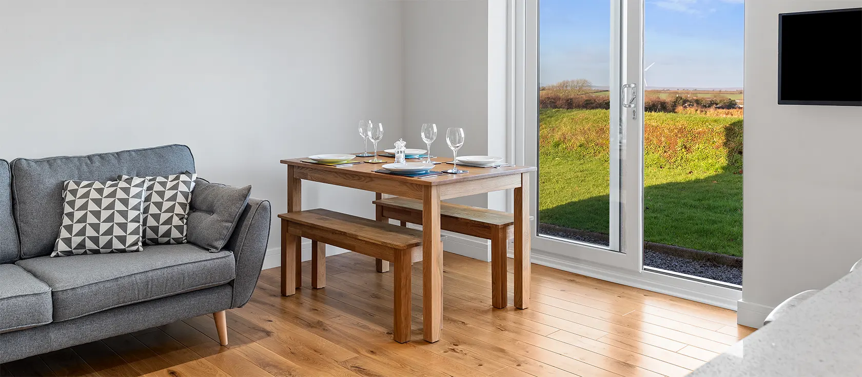 The Keys, Hill Mountain is a modern two bedroom bungalow for four on the outskirts of Llangwm with stunning Preseli views. Comfortably furnished open-plan living room with kitchen island. Garden & parking. Walk to pub, shops & watersports.