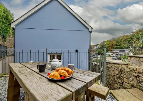 The patio & alfresco dining area at The New Dwelling, Tenby