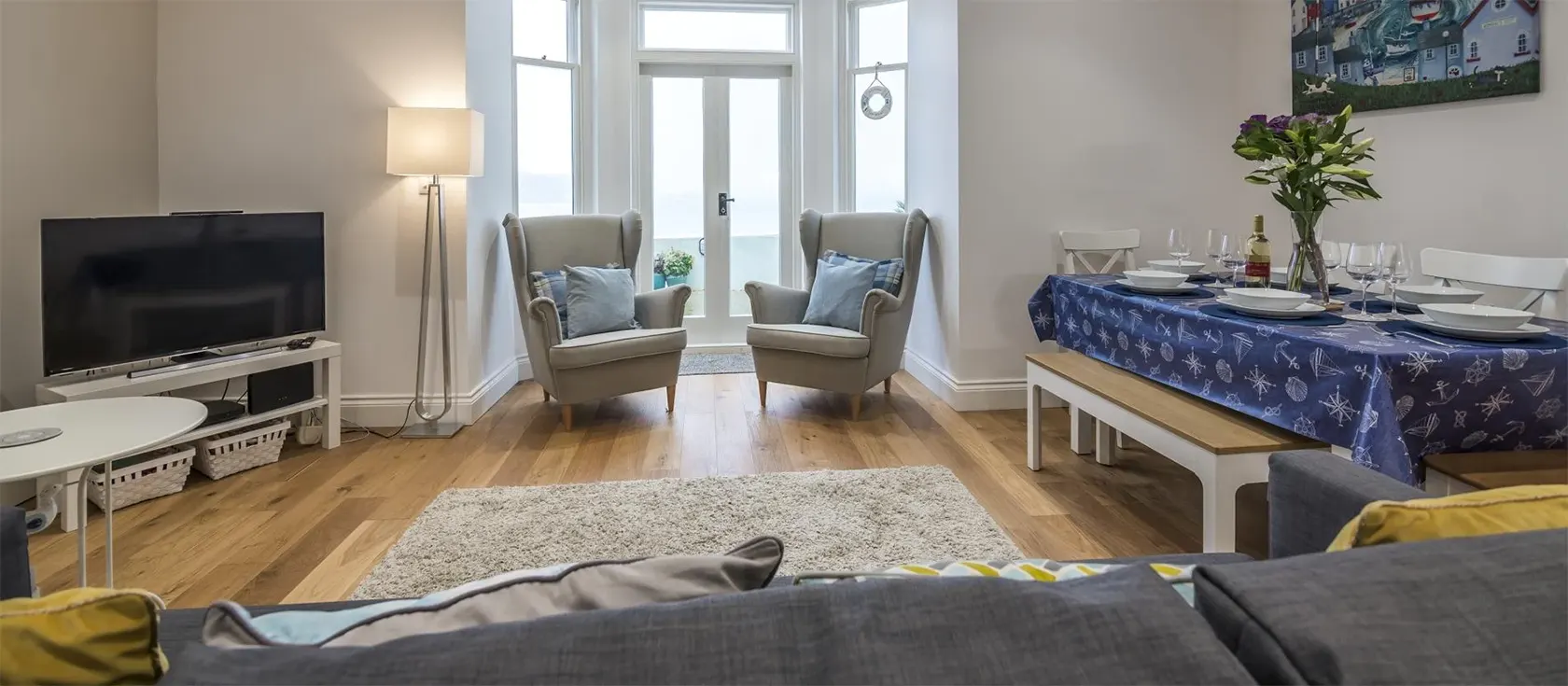 The Sweetness of Water, Tenby is a two bedroom apartment with a private patio offering breathtaking sea views. Located minutes from three beaches & the town centre.