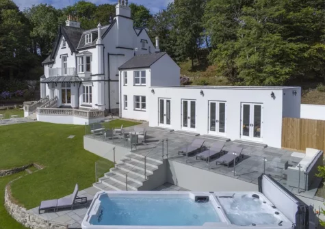 The upper terrace, swimming pool & garden at To The Manor Born, Penally