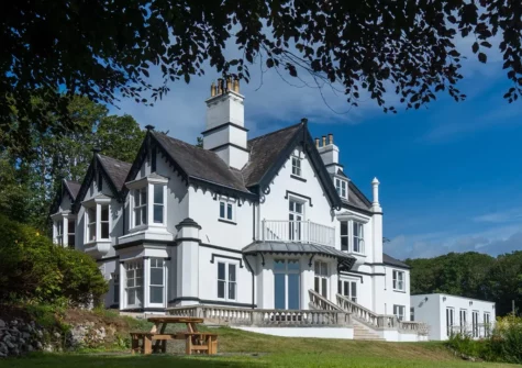 Flowerbeds bursting with bloom and secret grottos fill the gorgeous grounds of To The Manor Born, Penally