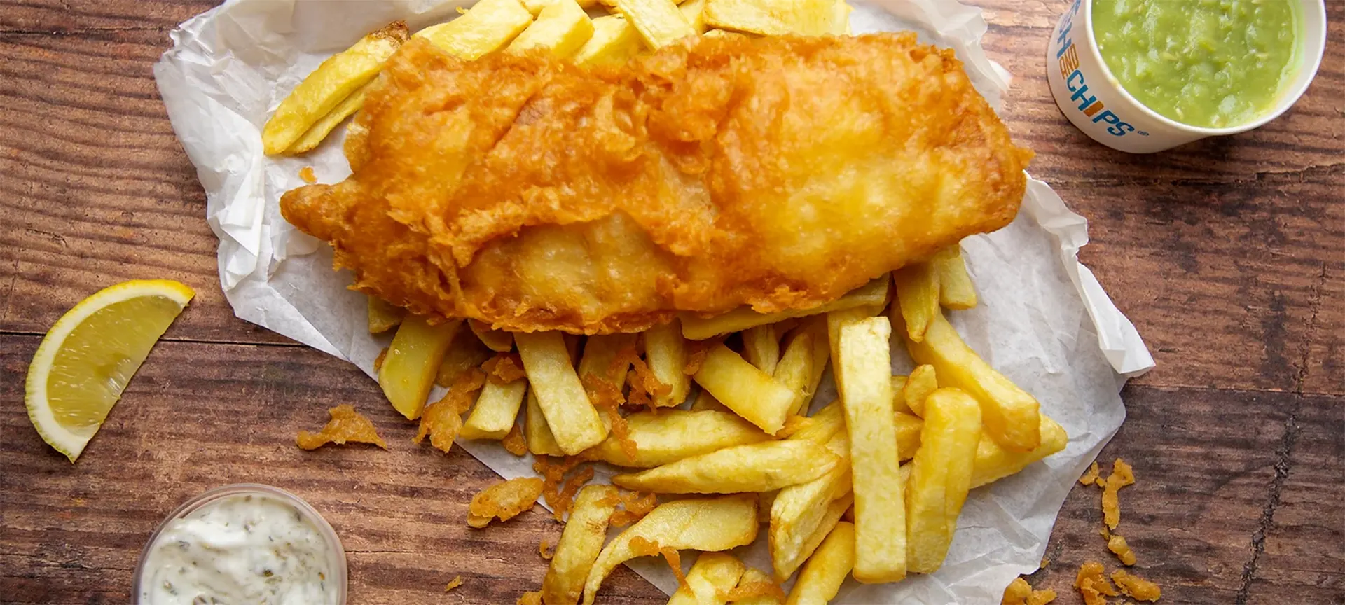 If there is one iconic dish that the UK is known for around the world it is fish and chips. This simple but finger licking meal is both humble and can be eat with your hands wrapped up in paper from a local "chippy" or in a smart restaurant. The dish has two parts and the fish came first. The tradition of eating fish that had been coated with flour and fried in oil can be traced back to the early 1800s and its thought that it was bought to Britain by Jewish immigrants from Spain and Portugal, where fish was cooked in this fashion. Then came the chips and the earliest record of chips being served in the UK was on the northern city of Oldham in 1860. But the main question of when this heavenly combination of fish and potato was combined remains a mystery.