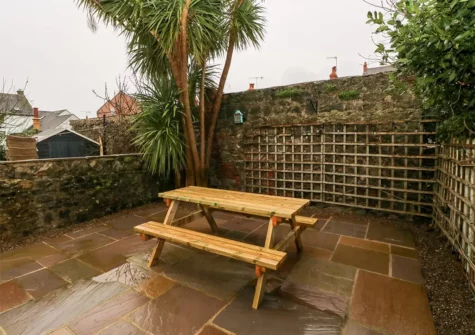 The patio & alfresco dining area at Ty Cwtch, Tenby