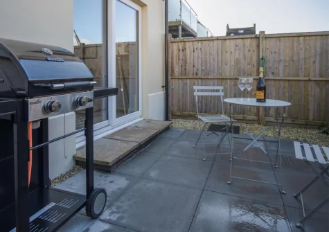 The enclosed garden & barbecue area at Ty Melyn, Tenby