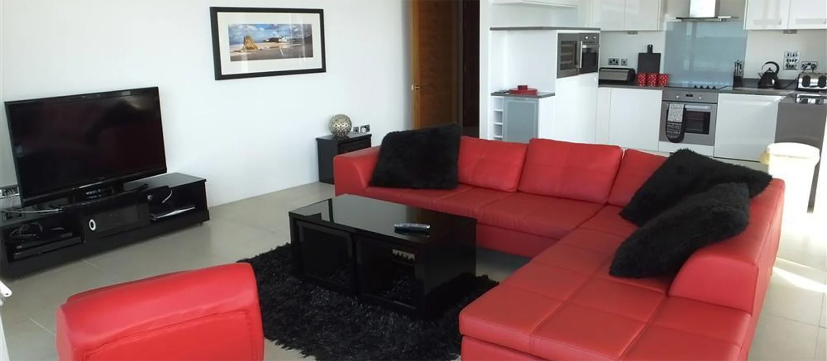 Ty Traeth, Tenby is right on South Beach with floor-to-ceiling windows opening onto a spacious balcony. Contemporary furnishings, modern kitchen with wine cooler & dishwasher, two bedrooms (one ensuite) & parking. Walk to everything!