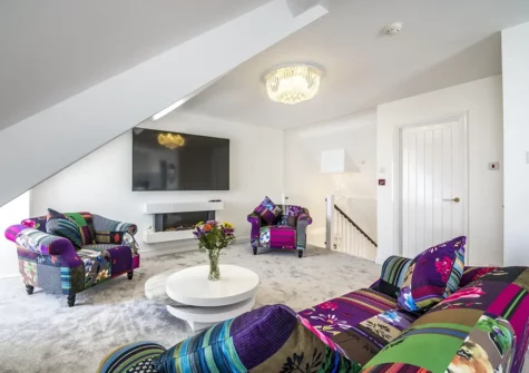 The living area at Watching The Waves, Tenby