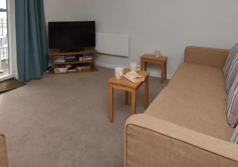 Waters Edge 14, Saundersfoot is a spacious third-floor apartment with great beach views and a private balcony. Just steps from golden sands and village amenities, this two-bedroom haven offers coastal charm and modern comfort for families & couples.