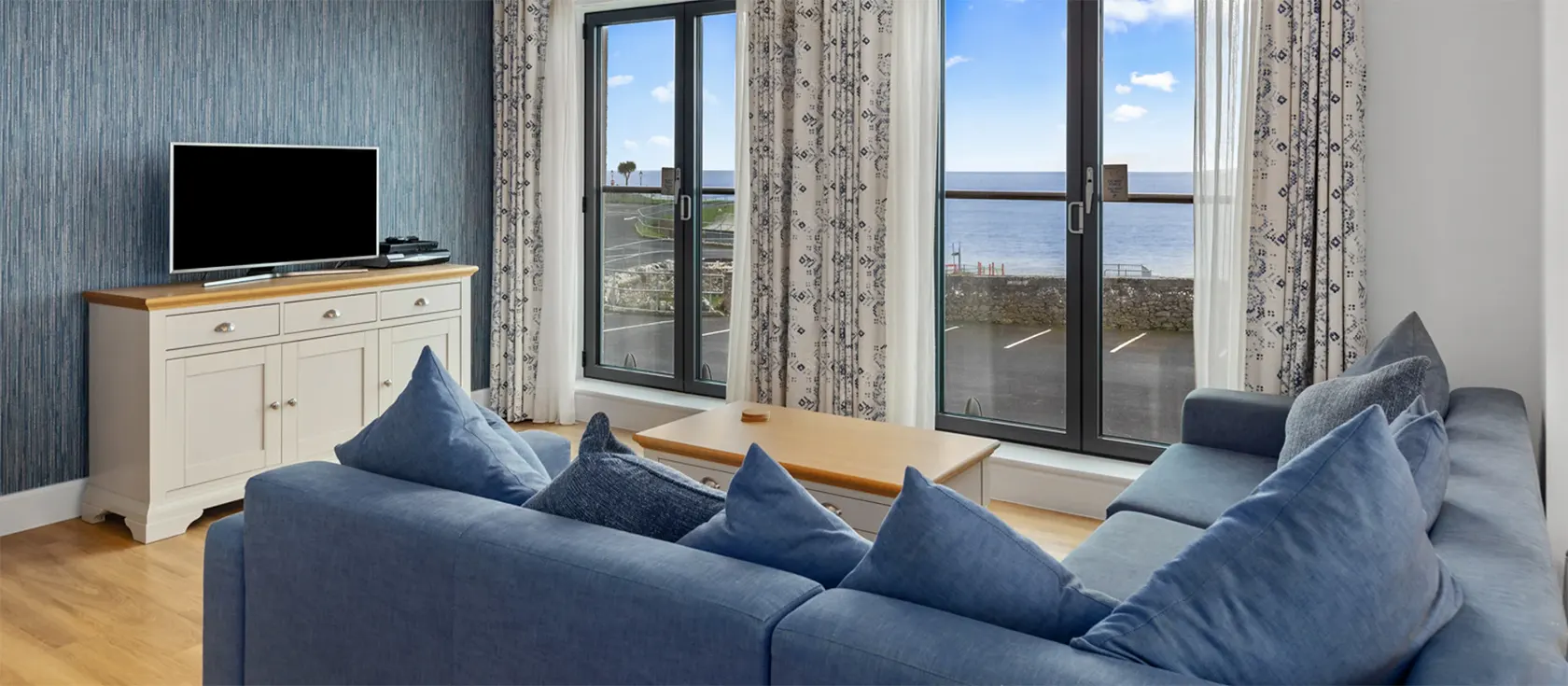 Welsh Cake, Tenby is a spacious, airy apartment with stunning views from its many balconies. Sleeps up to six in three bedrooms. Pet friendly. Close to the beach.