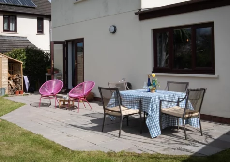 The patio, barbecue & alfresco dining area at Woodfield House, Tenby