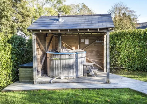 Enjoy long luxurious soaks in the secluded hot tub at Writing History, Tenby