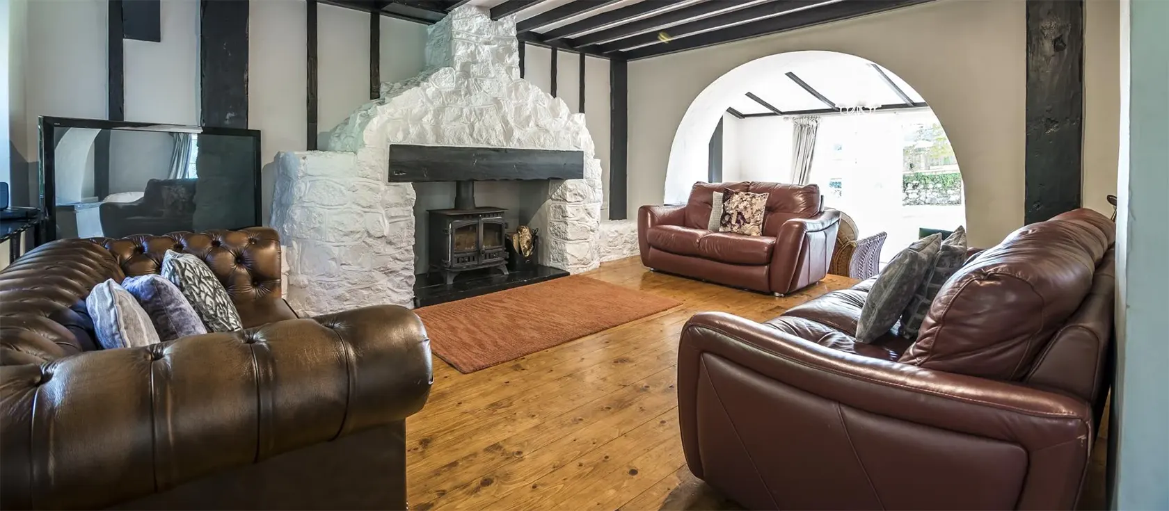 Writing History, Tenby is an atmospheric 17th century converted barn perfect for large families. The property blends original features with a large sleek kitchen and modern bathrooms and the garden has a kids' playground, and a wood-fired hot tub.